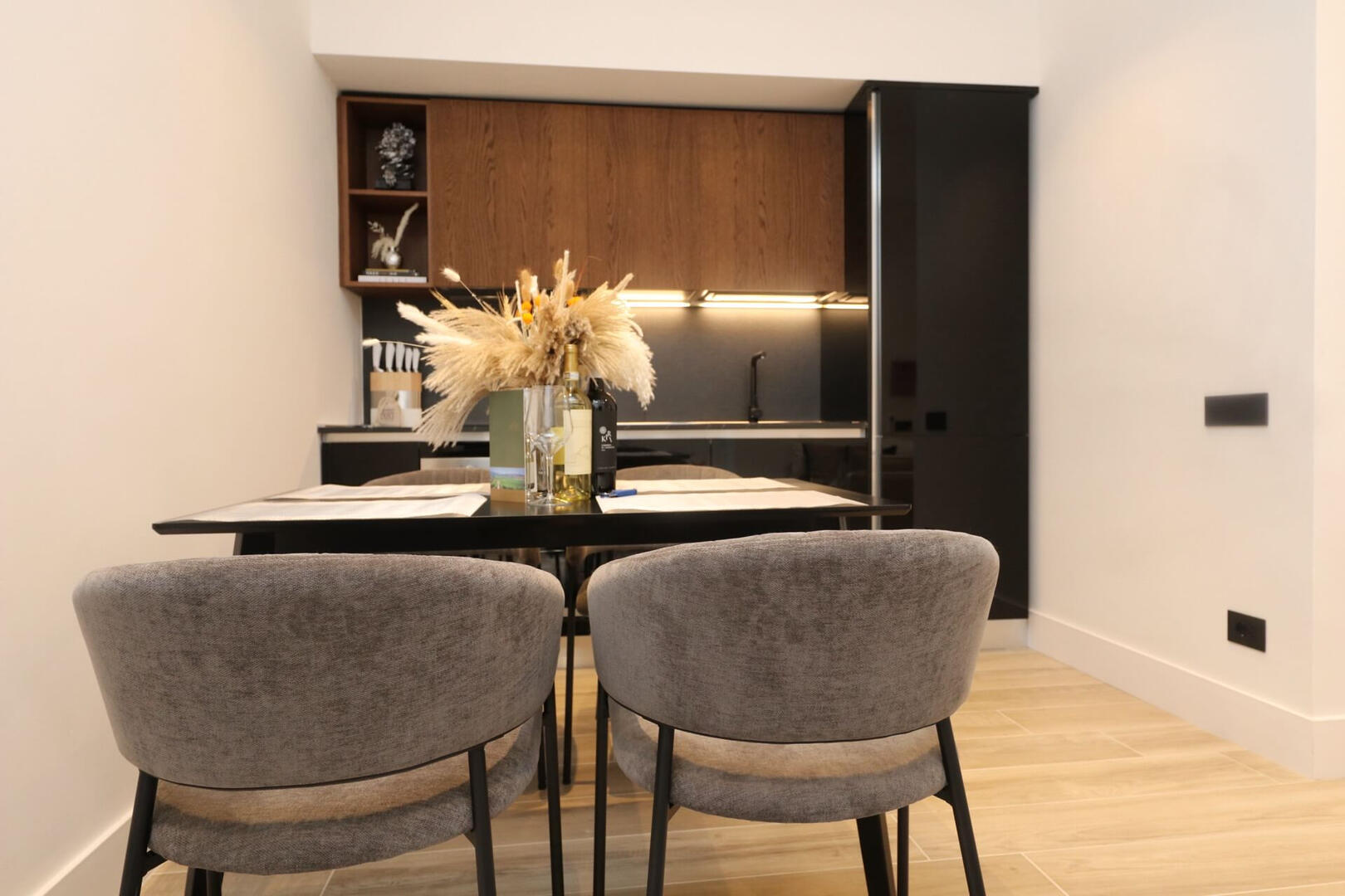 Behind Dining Table into Kitchen